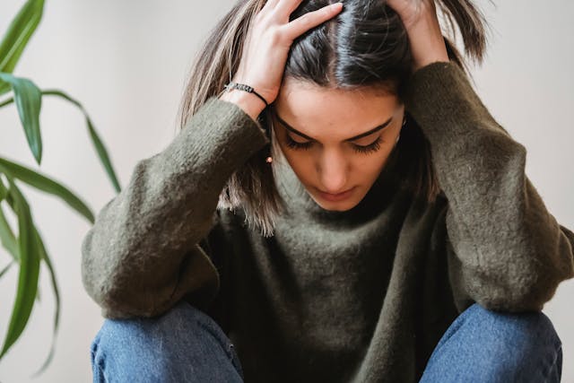 A person looking thoughtful, learning how to stop negative thoughts